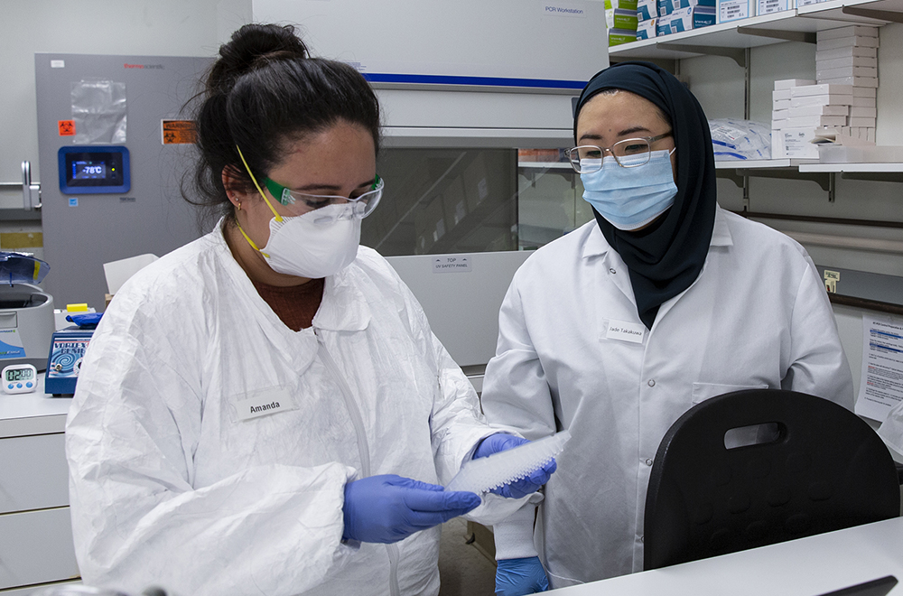 Amanda Reid and Jade Takaua in the lab