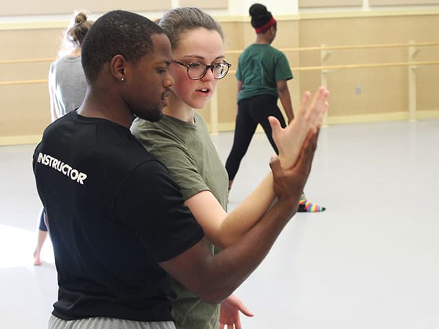 D.J. mentoring dance students