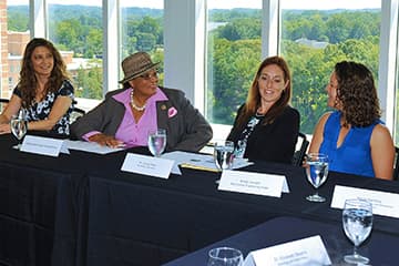 Congresswoman Adams, second from left, speaking with students