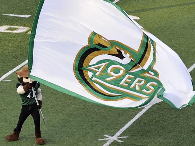 Norm with a Charlotte 49ers flag